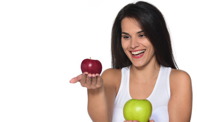 smiling woman with healthy teeth holding/eating apple. studio isolated portrait.