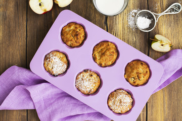 Apple cupcakes over wooden table