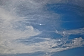 Bright blue sky with white clouds