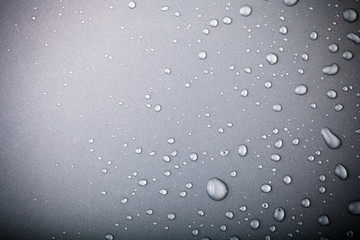 Drops of water on a color background. Gray. Toned