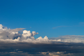 Blue sky with white cumulus clouds