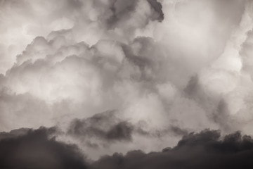 Blue sky with white cumulus clouds. Toned