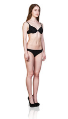 Young woman stands in black lingerie