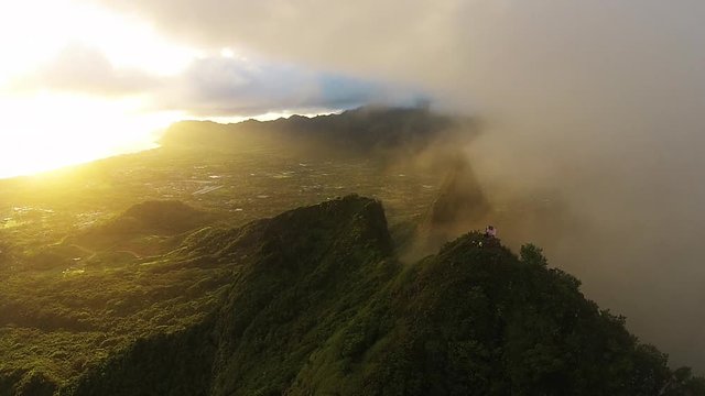 Mount Olomana scenic with people in Kailua, Hawaii, aerial sunset tropical paradise.