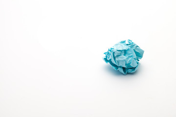 close-up of crumpled paper ball,  blue wadded paper