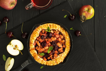 Apple and cherry pie with ingredients