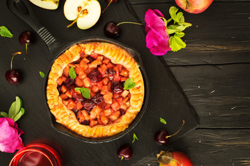 Apple and cherry pie with ingredients
