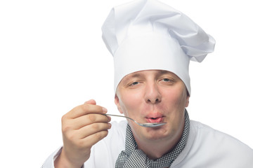cook on a white background blowing on a spoon