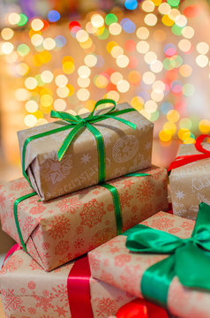 christmas gifts indoor on defocused lights background space for text