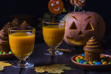 Halloween cocktail, pumpkin orange drink with spices