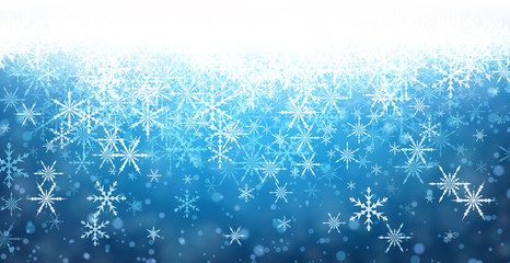 Blue winter background with snowflakes.