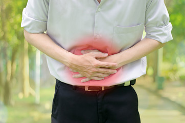 Man suffering from stomach ache because he has diarrhea