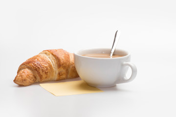Cup with coffee and croissant, french breakfast