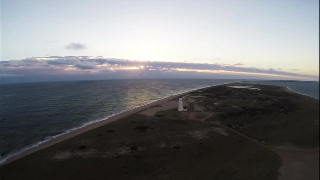 Lighthouse and beach sunset aerial, Nantucket, Massachusetts.
