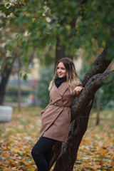 Beautiful girl in autumn Park