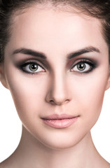 Young woman with smokey eyes make-up.