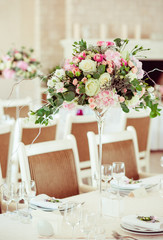 White and beig chair stand at the festive dinner table