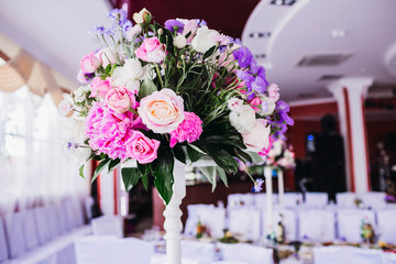 beautiful and tender flowers in a vase at the wedding
