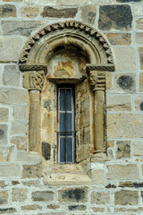 Fototapeta na wymiar sight of a window of the Romanesque collegiate church of San Salvador in Cantamuda in Palencia, Castile and León, Spain