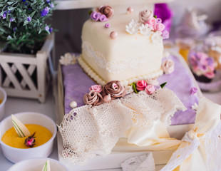 beautiful and delicate wedding cake in purple tones