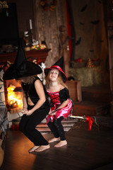 sisters Girls witch with  broom . Halloween