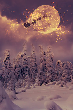 Santa Claus with reindeer flying through the sky.