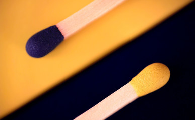 Matches abstract diagonal position in blue and yellow color on the own box