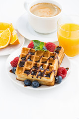 traditional sweet waffles and espresso on white table, top view