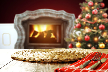 wooden table place and xmas tree 