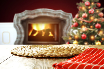 Obraz premium wooden table place and xmas tree 