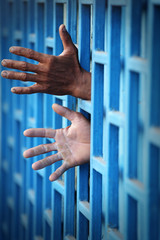 hand of prisoner in jail