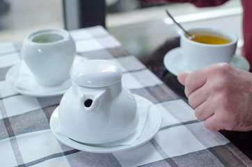 tea cup in man's hands