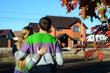 Couple looking on house