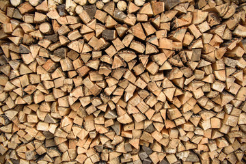 the wood stacked against the wall, rustic background