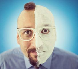 Conceptual two sides face portait photo of a businessman