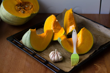 Cooking roasted spicy pumpkin on oven tray