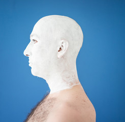 Artistic painting man face in white