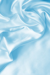 Smooth elegant blue silk or satin as background