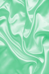 Obraz premium Smooth elegant green silk or satin texture as background