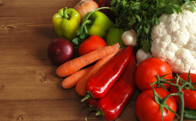 Healthy organic vegetables on brown wooden table