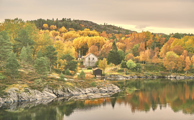 Bay and old wooden buildings fjord