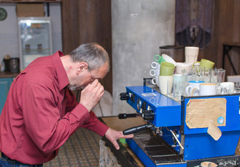 Aged man making coffee