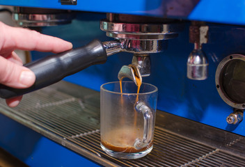 Aged man making coffee