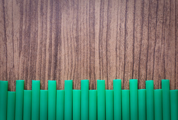 drinking straw on wood board
