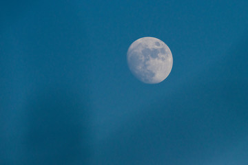 Moon in a blue sky