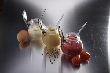 mustard, ketchup and mayonnaise - three kinds of sauces