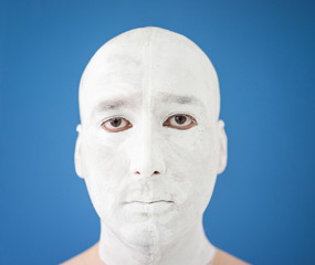 Artistic painting man face in white