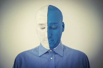 Blue and white face portait photo of a man