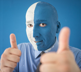 Blue and white face portait photo of a man
