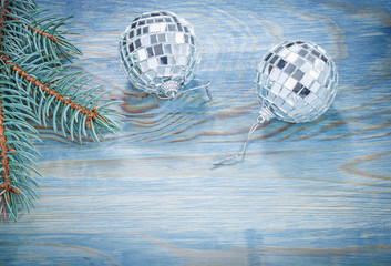 Christmas mirror balls pine twig on wooden board holidays concep